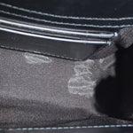 Close-up of the bag's dark fabric lining and interior zipper pocket