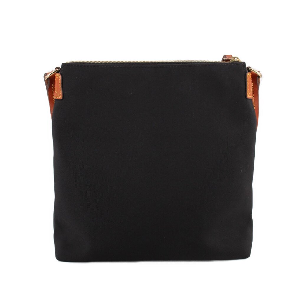 Dooney & Bourke black nylon crossbody bag showing its plain back panel and brown strap tabs