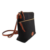 Dooney & Bourke black nylon crossbody bag shown at an angle, with brown strap and trim