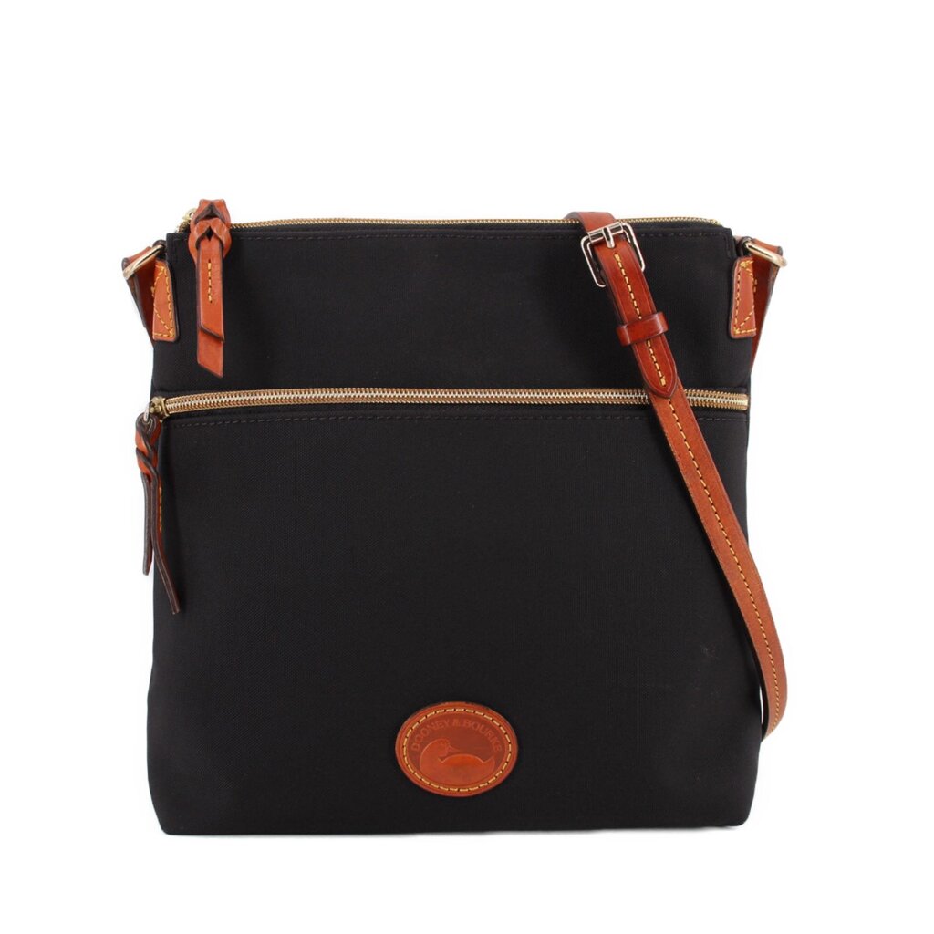 Dooney & Bourke black nylon crossbody bag with brown trim, front zip pocket, and logo patch