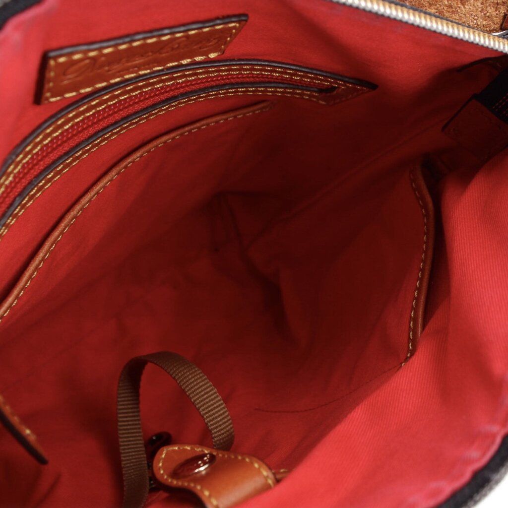 Dooney & Bourke crossbody bag interior with red lining, zip pocket, and slip pockets