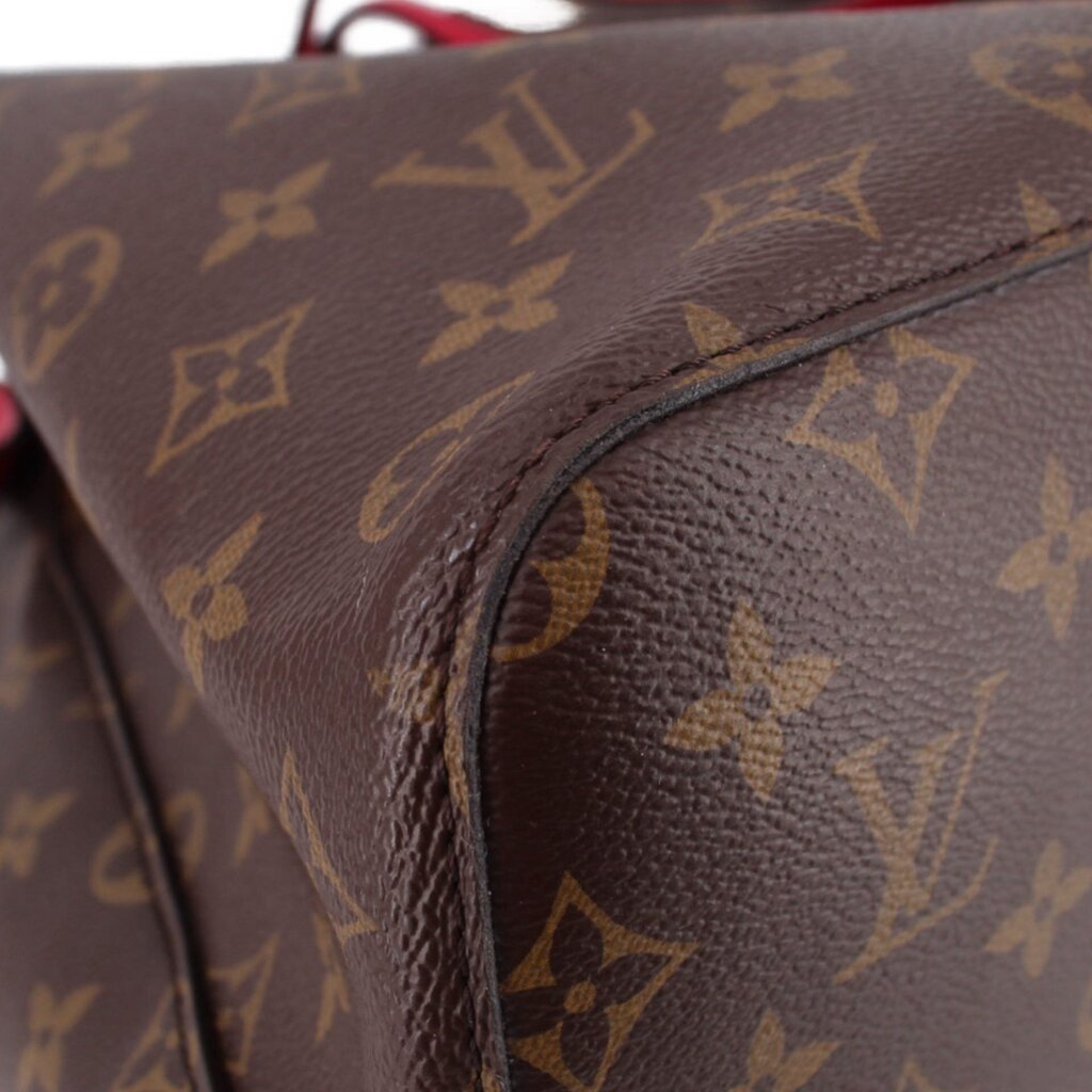 Close-up of monogram canvas and stitched corner on the bucket bag