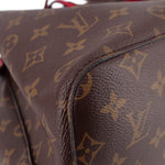 Close-up of monogram canvas and stitched corner on the bucket bag