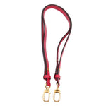 Red adjustable shoulder strap with gold-tone clips for Louis Vuitton bucket bag