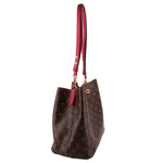 Louis Vuitton bucket bag side profile showing monogram canvas and red strap