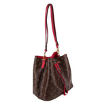 Louis Vuitton monogram bucket bag, angled view with red trim and gold-tone hardware