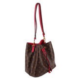 Louis Vuitton monogram bucket bag, angled view with red trim and gold-tone hardware