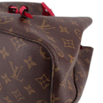 Close-up of bucket bag base seam and red drawstring detail