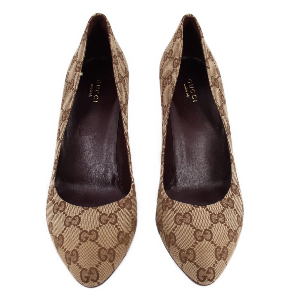 Pair of GUCCI brown GG monogram pointed-toe pumps, viewed from the front