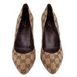 Pair of GUCCI brown GG monogram pointed-toe pumps, viewed from the front