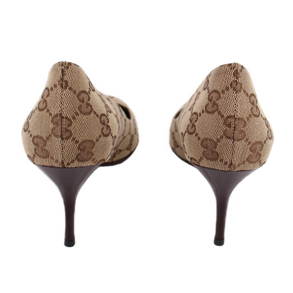 Pair of GUCCI brown GG monogram pumps showing the heel backs and slim heels