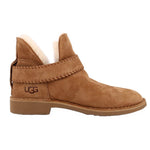 UGG brown suede bootie, side view, with stitched cuff and logo at the heel
