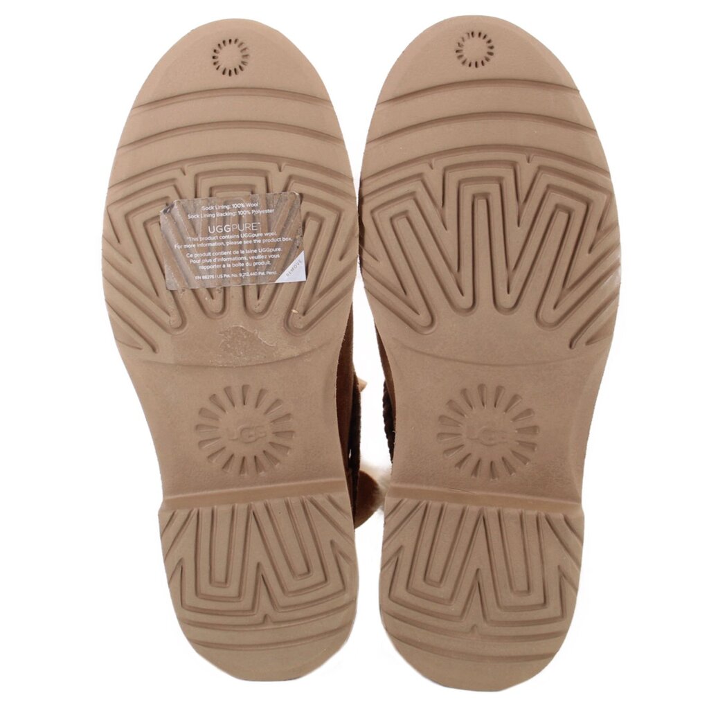 Pair of booties with tan rubber soles featuring deep patterned treads