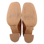 Pair of Mary Jane heels showing tan soles, block heel caps, and Seychelles branding