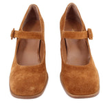 Pair of brown suede Mary Jane heels with buckle straps, shown from the front