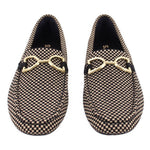 Pair of Rothy's black and cream checkered loafers with gold-tone bit hardware