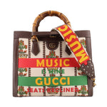 GUCCI Diana Centennial tote with bamboo handles, floral tapestry, and colorful slogan bands