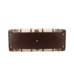 GUCCI tote bottom with brown leather base, gold feet, and patterned fabric edges