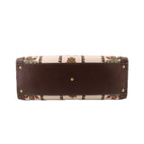 GUCCI tote bottom with brown leather base, gold feet, and patterned fabric edges