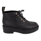 CHANEL black leather ankle boot in side view, with lace-up front and thick platform sole
