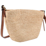 LOEWE raffia crossbody bag shown from the side, with leather strap and trim