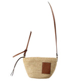 LOEWE raffia crossbody bag with adjustable tan leather strap and embossed logo patch