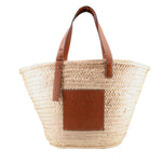 LOEWE large natural palm-leaf tote with brown leather handles and embossed logo patch