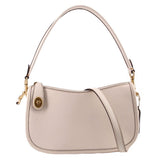 COACH Swinger cream leather crossbody bag with gold-tone hardware and two straps