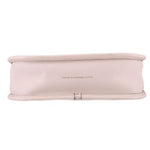 Bottom of the cream COACH Swinger leather bag with a centered leather stamp