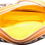 GOYARD Cap-Vert PM bag opened to show its bright yellow lining and inner zip pocket
