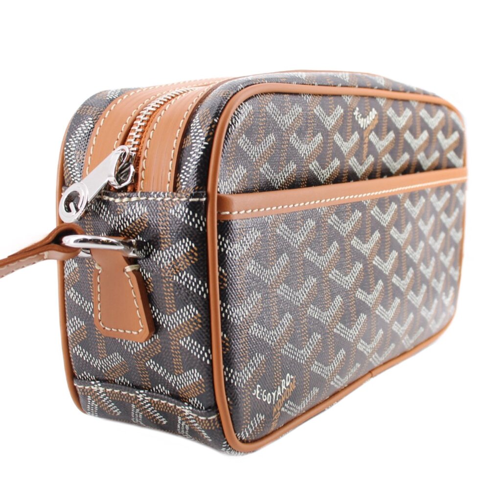 GOYARD Cap-Vert PM crossbody bag shown from the side, with twin zippers and tan leather trim