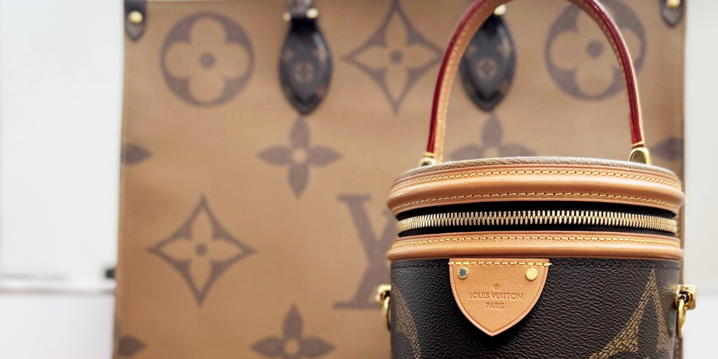 Two Louis Vuitton handbags with the Giant Monogram coated canvas.