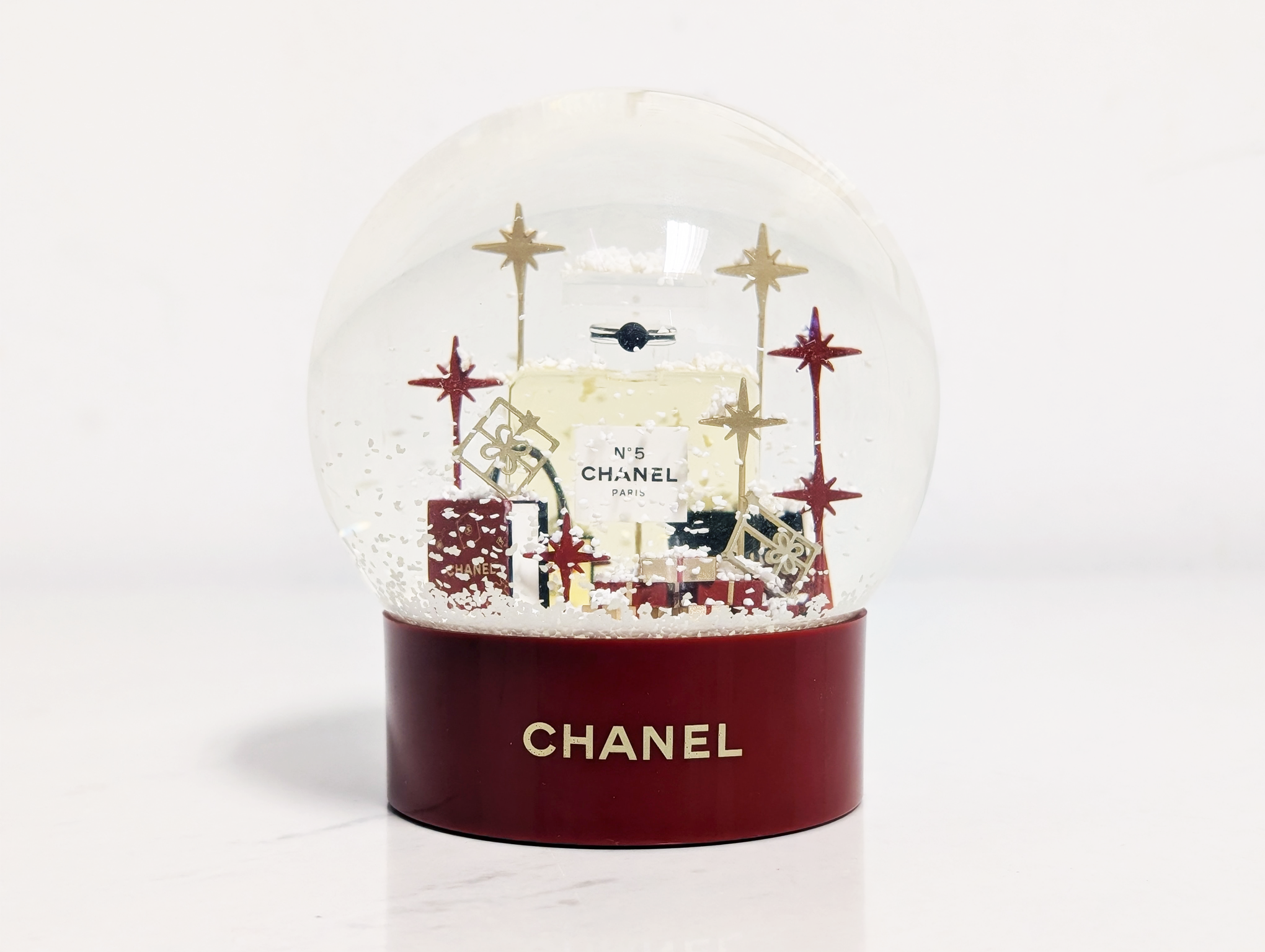 Chanel snowglobe on a white background.