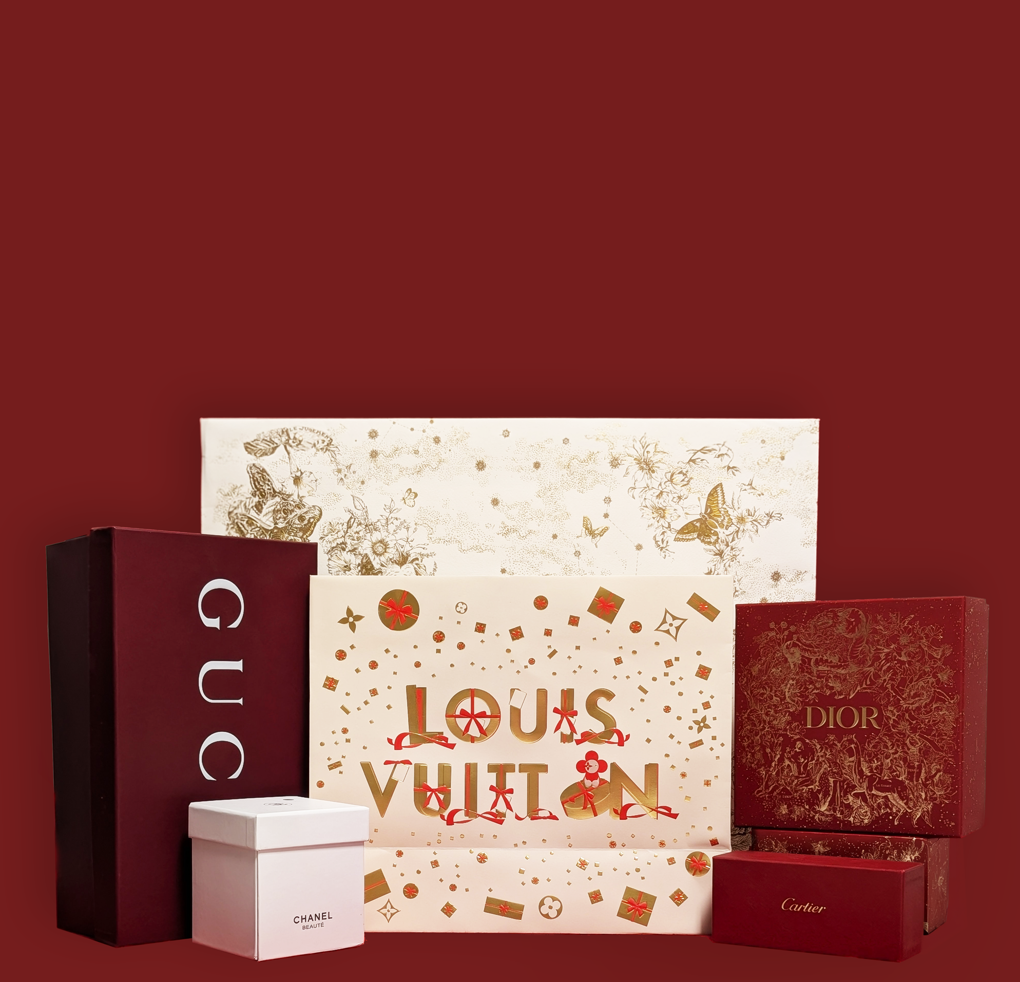 Louis Vuitton gift bag with Gucci, Chanel, Cartier, and Dior boxes on a red background