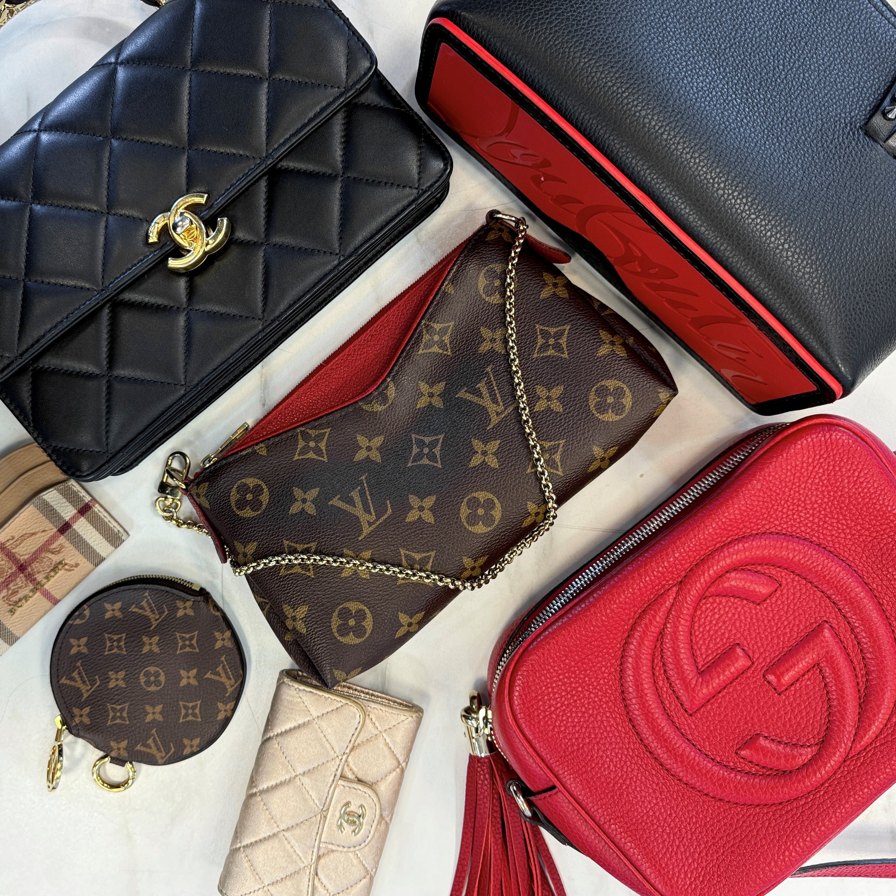 A photo of a variety of high-end luxury brand handbags and accessories.